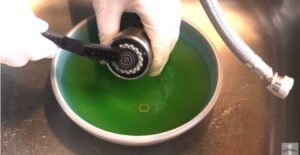 how to clean delta kitchen faucet head