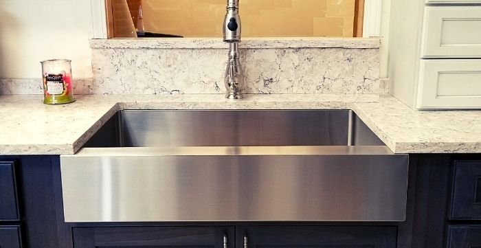 can I put a farmhouse sink in existing cabinets