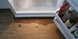 what causes a refrigerator to leak water